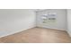 Bedroom with light wood floors and bright natural light at 1121 Landen Creek Ln, Zebulon, NC 27597