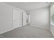 Neutral bedroom with carpet, white walls and trim, and bright natural light at 1121 Landen Creek Ln, Zebulon, NC 27597