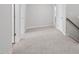 Spacious upstairs hallway features neutral carpet, white walls and trim, and bright natural light at 1121 Landen Creek Ln, Zebulon, NC 27597