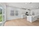 Bright, open-concept kitchen with a large island, modern appliances, and abundant natural light at 1121 Landen Creek Ln, Zebulon, NC 27597