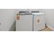 A well-lit laundry room featuring a new washing machine and dryer at 1121 Landen Creek Ln, Zebulon, NC 27597
