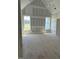 Large bedroom with vaulted ceilings and natural light streaming through the windows at 11226 Old Beulah Rd, Kenly, NC 27542
