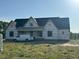 New construction home showing the exterior with a work van parked nearby at 11226 Old Beulah Rd, Kenly, NC 27542