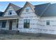 View of the new home's front exterior, showcasing large windows at 11226 Old Beulah Rd, Kenly, NC 27542