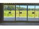 Sliding glass doors open to an expansive patio overlooking the backyard space at 11226 Old Beulah Rd, Kenly, NC 27542