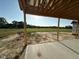 View from the porch showing the unfinished brick and views of the home's expansive yard at 11226 Old Beulah Rd, Kenly, NC 27542