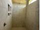New shower featuring modern tile, recessed niche, and updated fixtures in progress at 11226 Old Beulah Rd, Kenly, NC 27542