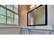 Clean bathroom with a vanity, large mirror, and natural light, providing a refreshing space at 113 Union Mills Way, Cary, NC 27519