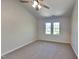 Cozy bedroom with neutral carpet, ample natural light from large windows, and a soothing ambiance at 113 Union Mills Way, Cary, NC 27519