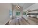 Inviting dining area with hardwood floors, stylish chandelier, and adjacent kitchen, offering a seamless flow for entertaining at 113 Union Mills Way, Cary, NC 27519