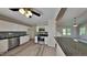 Modern kitchen with stainless steel appliances, granite countertops, white cabinets, and open to dining area and living room at 113 Union Mills Way, Cary, NC 27519