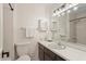 Bright bathroom featuring a vanity with granite countertop and classic shower and tub combination at 1209 Shincliffe Ct, Cary, NC 27511