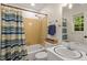 This bathroom features a shower and tub combination and vanity at 1209 Shincliffe Ct, Cary, NC 27511