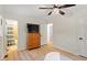 Bright bedroom featuring wood flooring with an ensuite bath at 1209 Shincliffe Ct, Cary, NC 27511