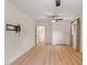This bedroom offers wood flooring, an interior closet, and a ceiling fan at 1209 Shincliffe Ct, Cary, NC 27511