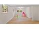 Finished basement with two windows, modern flooring, and a play area at 1209 Shincliffe Ct, Cary, NC 27511