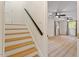 Hallway featuring hardwood stairs that lead to the upper level bedrooms at 1209 Shincliffe Ct, Cary, NC 27511