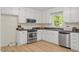 Well-lit kitchen boasting stainless steel appliances and plenty of counter space and storage at 1209 Shincliffe Ct, Cary, NC 27511