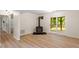 Spacious living room with fireplace and sliding glass doors at 1209 Shincliffe Ct, Cary, NC 27511