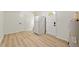 Utility room features modern flooring and white appliances at 1209 Shincliffe Ct, Cary, NC 27511