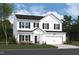 Beautiful two-story home featuring white siding, black shutters, and a two-car garage at 1248 Dimaggio Dr # 37, Raleigh, NC 27616
