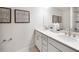 Elegant bathroom with double sink vanity, quartz countertops, and modern fixtures, providing a spa-like experience at 1248 Hardin Hill Ln, Knightdale, NC 27545