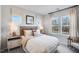 Cozy bedroom features large windows, soft lighting, neutral color palette, and comfortable furnishings at 1248 Hardin Hill Ln, Knightdale, NC 27545