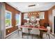 Dining room with an elegant chandelier, round mirror, and views to the outside at 1248 Hardin Hill Ln, Knightdale, NC 27545