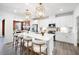 Contemporary kitchen with white cabinets, stainless steel appliances, and an expansive island at 1268 Hardin Hill Ln, Knightdale, NC 27545