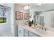 Main bathroom features double sinks, a large mirror, and a glass-enclosed shower at 1268 Hardin Hill Ln, Knightdale, NC 27545