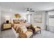 The main bedroom features neutral colors, a ceiling fan, a queen-size bed, and an ample sitting area at 1268 Hardin Hill Ln, Knightdale, NC 27545