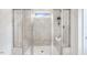 The bathroom features a spacious, tiled shower with dual seating at 1268 Hardin Hill Ln, Knightdale, NC 27545