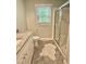 Bright bathroom featuring granite countertop, a walk-in shower, and neutral colors at 131 Rosewood Dr Dr, Roxboro, NC 27573