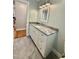 Bathroom featuring gray countertop, white cabinets, tile flooring and a mirror at 131 Rosewood Dr Dr, Roxboro, NC 27573