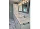 Bathroom featuring double vanity, marble countertop, and contemporary lighting at 131 Rosewood Dr Dr, Roxboro, NC 27573