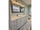 Bathroom featuring double vanity, marble countertop, and contemporary lighting at 131 Rosewood Dr Dr, Roxboro, NC 27573