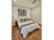 Cozy bedroom features a comfortable bed, hardwood floors, and two bedside tables with lamps at 131 Rosewood Dr Dr, Roxboro, NC 27573