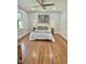 Bright bedroom with hardwood floors, a ceiling fan, large windows, and tasteful decor at 131 Rosewood Dr Dr, Roxboro, NC 27573