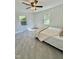 Bedroom with tiled flooring and two windows, providing natural light and a comfortable living space at 131 Rosewood Dr Dr, Roxboro, NC 27573