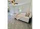 This bedroom features tiled flooring, two windows, beadboard walls, and a cozy bed at 131 Rosewood Dr Dr, Roxboro, NC 27573