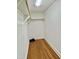 Walk-in closet featuring hardwood floors and built-in shelving and hanging space at 131 Rosewood Dr Dr, Roxboro, NC 27573