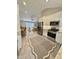Open concept kitchen with stainless steel appliances, white cabinets, and a view into the living room at 131 Rosewood Dr Dr, Roxboro, NC 27573