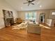 Inviting living room featuring a stone fireplace and lots of natural light at 131 Rosewood Dr Dr, Roxboro, NC 27573