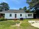 A backyard view of a quaint home with a neatly cut lawn at 1336 Hill St, Rocky Mount, NC 27801