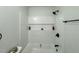 Modern white bathroom featuring a soaking tub and sleek, minimalist fixtures at 1336 Hill St, Rocky Mount, NC 27801