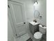 Charming powder room featuring a modern vanity and toilet for added convenience at 1336 Hill St, Rocky Mount, NC 27801