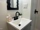Stylish bathroom with a modern sink, black faucet, and a convenient walk-in shower at 1336 Hill St, Rocky Mount, NC 27801