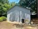 Exterior shot of a two-car garage with standard doors and concrete floor at 1336 Hill St, Rocky Mount, NC 27801