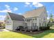 Beautiful home exterior with a spacious backyard, patio, and lush green lawn at 134 Barclay Valley Dr, Cary, NC 27519