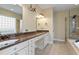Elegant bathroom featuring double vanity, granite countertop, tile flooring, and glass-enclosed shower at 134 Barclay Valley Dr, Cary, NC 27519